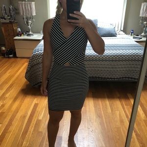 Black and white striped form fitting mini dress